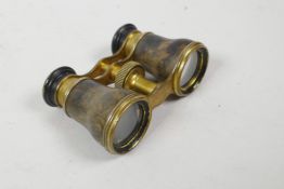 A pair of brass and faux tortoiseshell opera glasses by 'Lemaire fabt. Paris', circa 1900, 4" wide