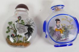 Two Peking glass snuff bottles with reverse decoration of cranes and a figure, 2½" long