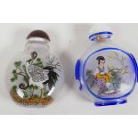 Two Peking glass snuff bottles with reverse decoration of cranes and a figure, 2½" long