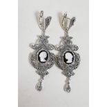 A pair of 925 silver and marcasite drop earrings set with cameo portraits, 2½" drop