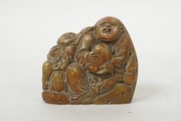 A Chinese soapstone carving of two figures and a peach, 2½" wide