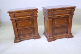 A pair of three drawer bedside chests, with cushion tops and moulded decoration, 23" x 15" x 25½"