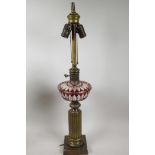 A Bohemian metal and glass table lamp in the form of an oil lamp with ribbed metal column and