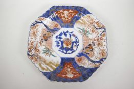 A Japanese Imari octagonal serving plate decorated in the traditional palette, 12" diameter