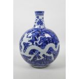 A Chinese blue and white porcelain moon flask with dragon decoration, incised character marks to