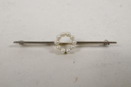 A 9ct white gold bar brooch with ten seed pearls, 2¼? long, 2.7g