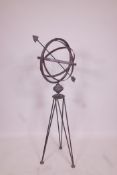 A painted wrought iron armillary, 40" high