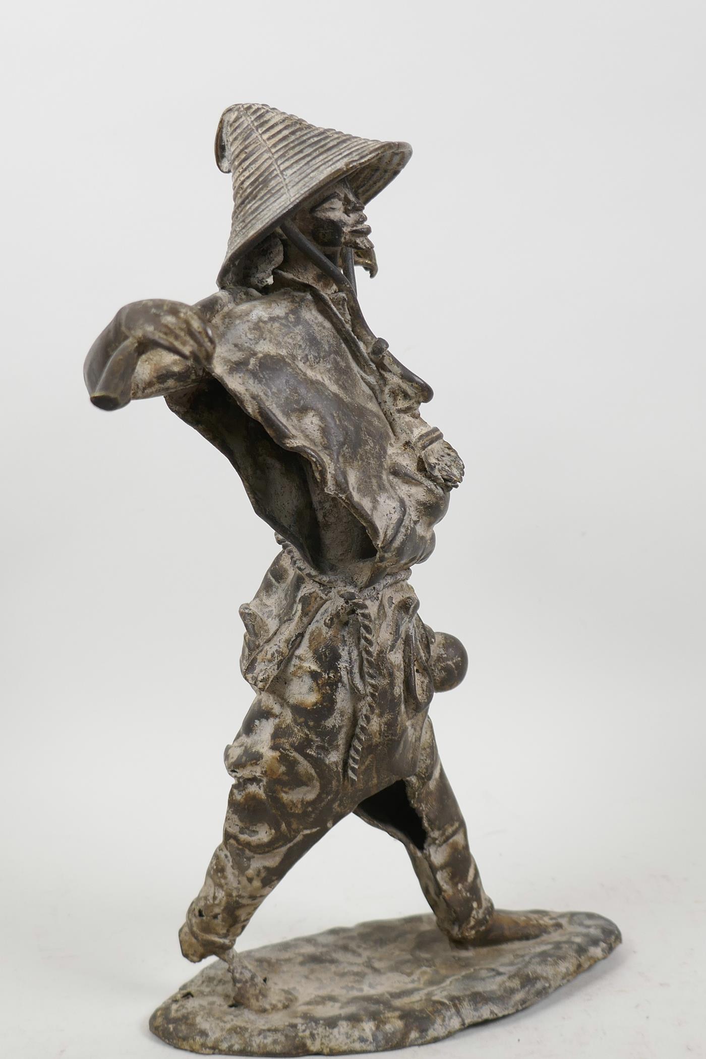 A Chinese stylised bronze figure of a fisherman, 13" high - Image 3 of 5