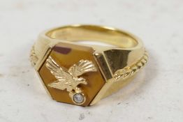 A large silver gilt American eagle ring set with tiger's eye and white stone, size 'Z'
