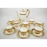 An elegant 1930s Copelands Grosvenor China coffee set, with rich gilded decoration in the Grecian