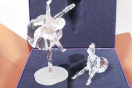A Swarovski Crystal figurine of a ballerina on point, number A7550-NR000-004, 6" high, together with