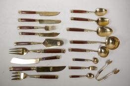 A six setting bronze canteen of cutlery with rosewood handles, in associated boxes