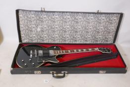 A Columbus Les Paul guitar, 39" long, in a carry case, A/F