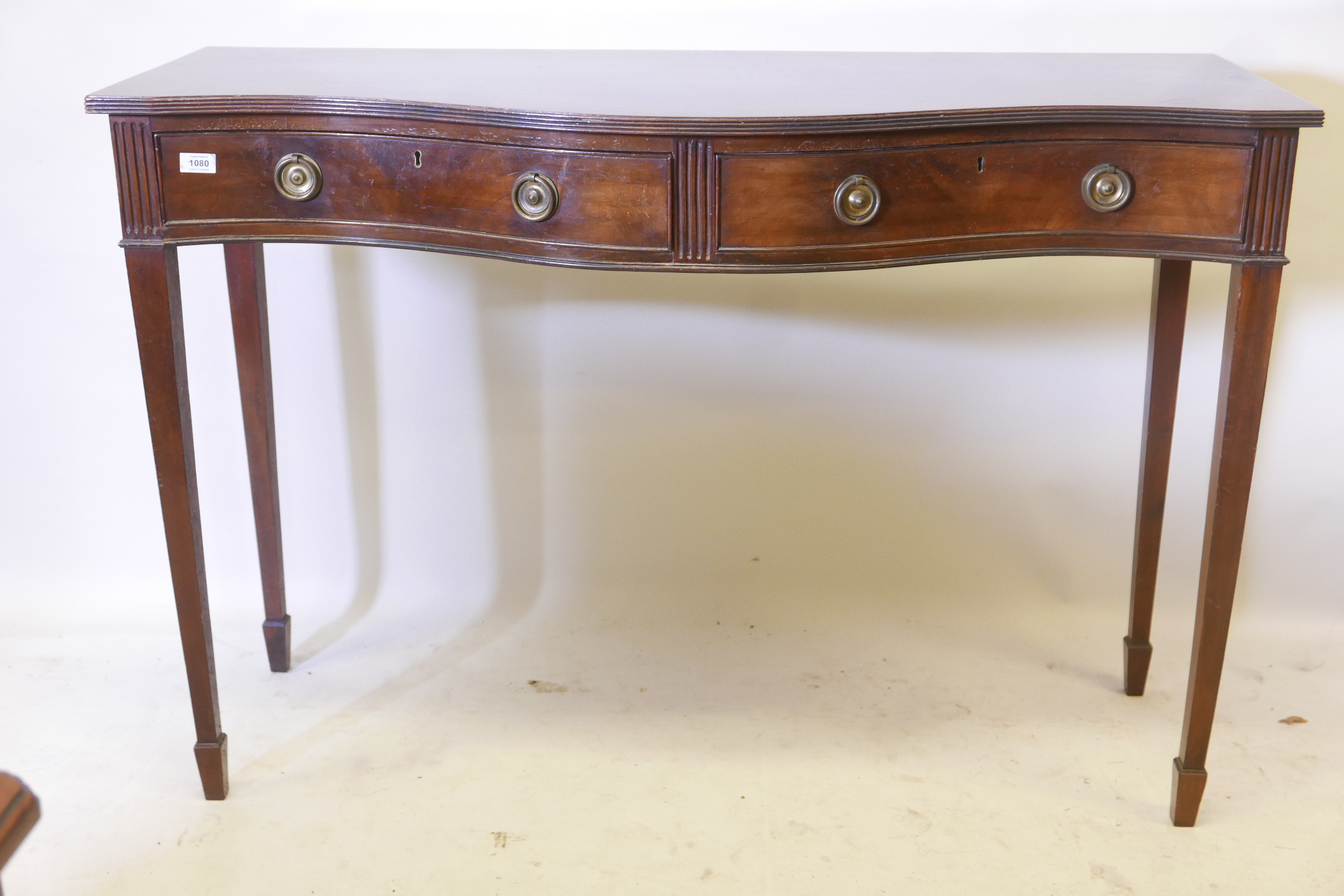 A C19th serpentine front mahogany serving table, with reeded edge top and two drawers with ring - Image 2 of 5