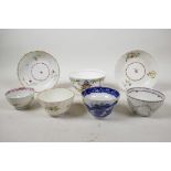 Three Dr. Wall first period Worcester (1751-1776) tea bowls and a saucer, a New Hall tea bowl and