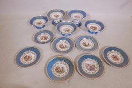 A Continental porcelain dessert service, with blue and gilt borders and transfer decoration, early