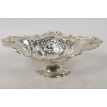 A hallmarked oval silver bonbon dish on pedestal base with pierced decoration, hallmarked Birmingham