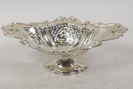 A hallmarked oval silver bonbon dish on pedestal base with pierced decoration, hallmarked Birmingham