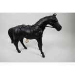 A leather horse with saddle and reins, 10½" high