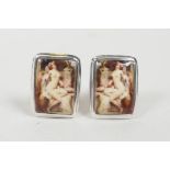 A pair of sterling silver and enamel cufflinks depicting a classical female nude
