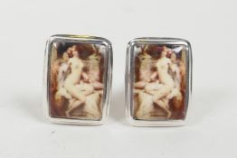 A pair of sterling silver and enamel cufflinks depicting a classical female nude