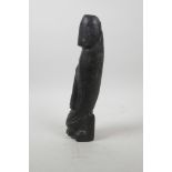 A Chinese carved hardstone phallic ornament, 10" long