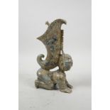 A Chinese jade carving of a figure with a horn shaped jue to back, 9" high