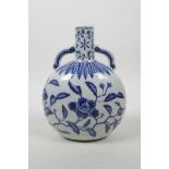 A Chinese blue and white porcelain two handled flask with floral decoration, 4 character mark to