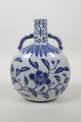 A Chinese blue and white porcelain two handled flask with floral decoration, 4 character mark to