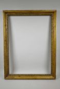 A giltwood picture frame with carved dentil decoration, rebate 25" x 18"