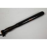 A small Victorian turned hardwood truncheon painted with initials, 12" long
