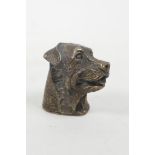 A brass vesta case in the form of a dog's head, 1½"