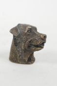 A brass vesta case in the form of a dog's head, 1½"