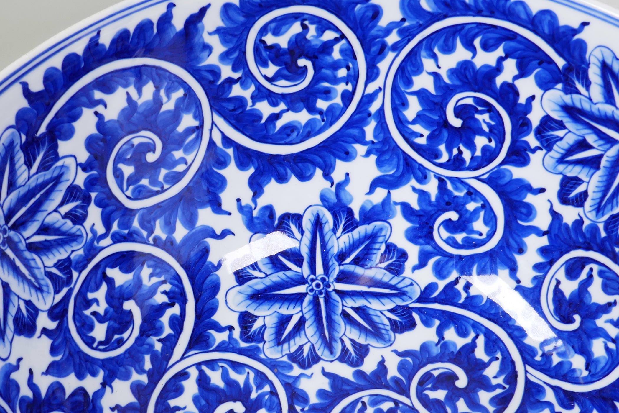 A large blue and white porcelain bowl with scrolling floral decoration, 14" diameter - Image 3 of 5