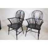 A pair of painted beech Windsor wheel back armchairs