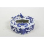A Chinese blue and white porcelain ink pot with applied bat and dragon decoration, 4½" x 4"