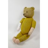 An early C20th humpback teddy bear, 23" long