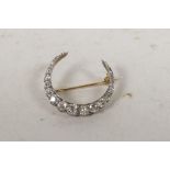 A fine antique yellow metal crescent brooch set with well cut diamonds, approx 3ct, 1¼? diameter, 4g