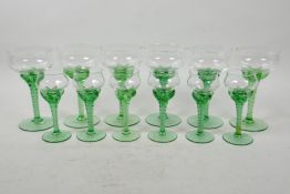 A set of six and six uranium wine and licquor glasses with spiral stems, A/F one chip and one