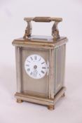 A brass and silver plated carriage clock, the silver faceplate with enamel dial, inscribed G.