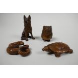 Four Japanese wooden netsuke, intricately carved boxwood figures of a snake, turtle, owl and wolf,