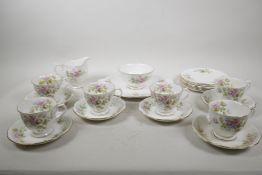 A Royal Albert Moss Rose six place setting service to include six teacups, saucers, cake plates,