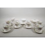 A Royal Albert Moss Rose six place setting service to include six teacups, saucers, cake plates,