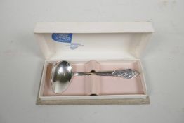 A boxed Dutch silver Christening spoon by Gero Zilvium, the handle decorated with a mother tending a