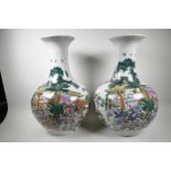 A pair of large Chinese famille verte porcelain vases of bulbous form decorated with a group of boys