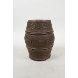An Indian turned and carved wood pot with floral decoration, 5½" high