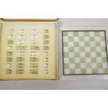 A small boxed onyx chess set and board, 10" square
