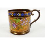 A large early Victorian Sunderland copper lustre mug, hand painted with brightly coloured flowers,