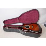 An Ovation electric acoustic guitar with hard carry case, 41" long