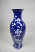 A Chinese underglaze blue and white porcelain prunus baluster vase, 5½" wide x 14" high